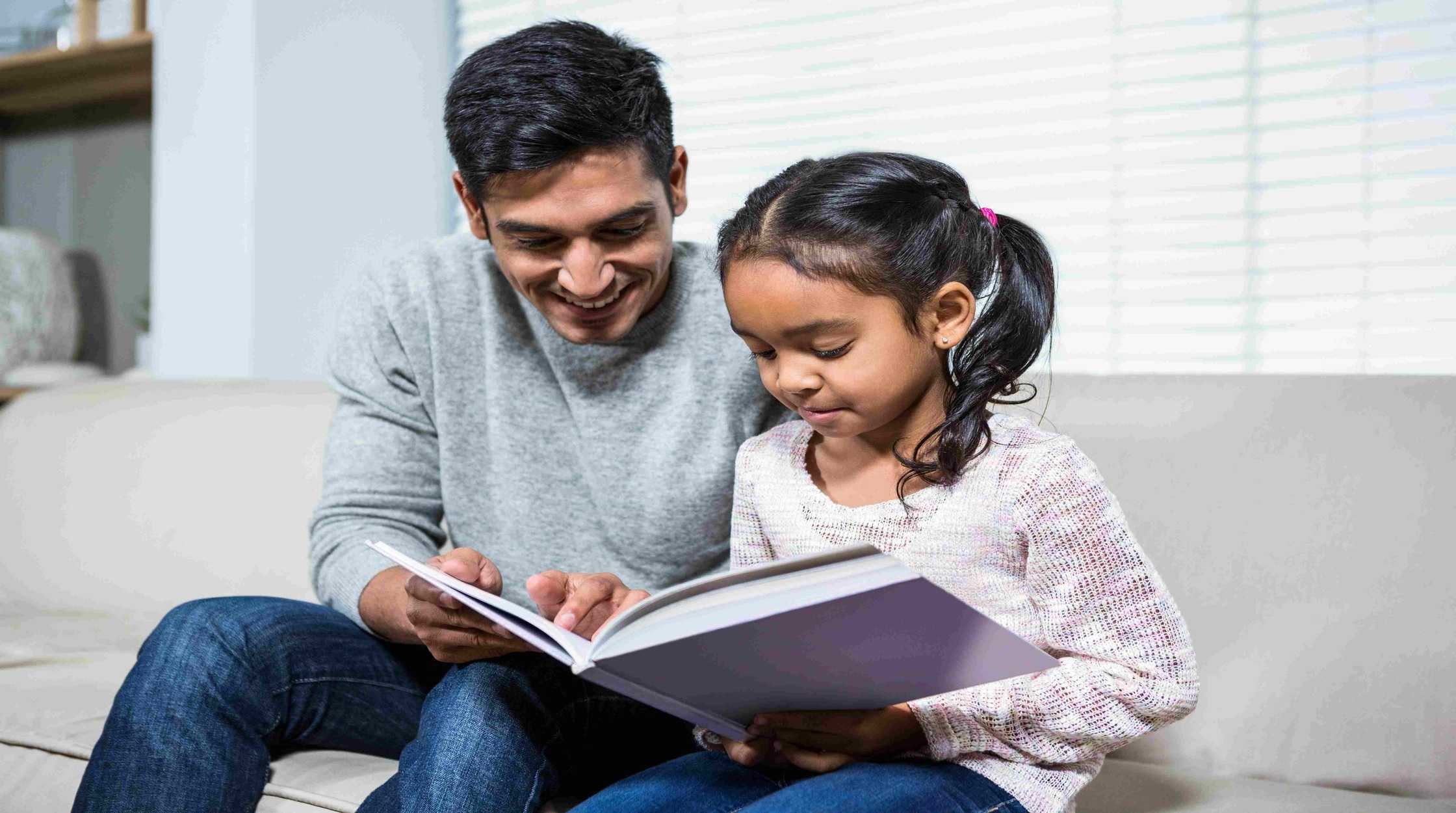 happy-father-daughter-reading-story-telling-book