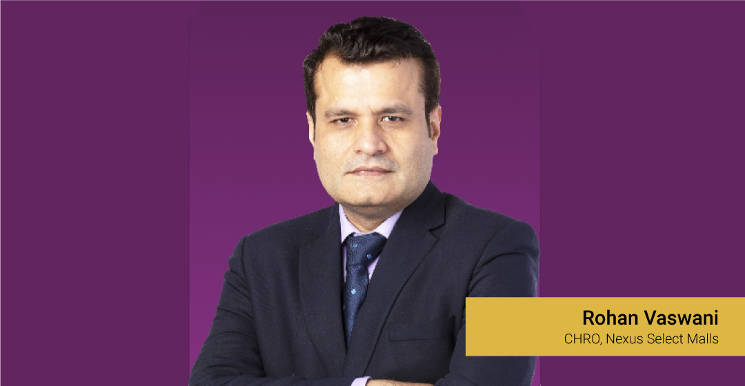 Rohan Vaswani, CHRO, Nexus Select Malls, standing against a purple background.