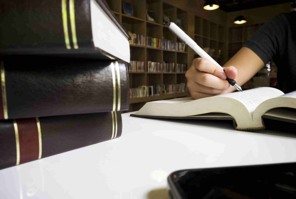woman-reading-book-library-min.jpg