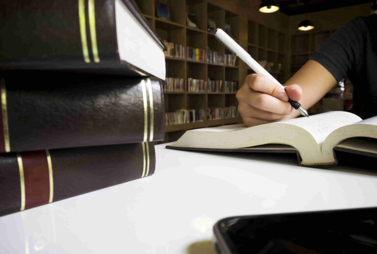 woman-reading-book-library-min.jpg