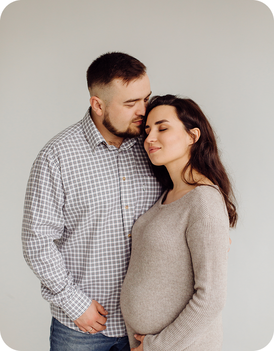 happy-handsome-man-hug-his-lovely-pregnant-wife.png