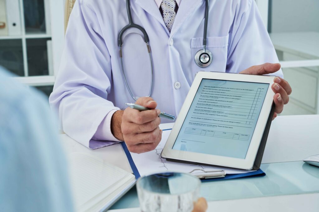 unrecognizable-doctor-extending-digital-tab-anonymous-patient-fill-questionnaire_11zon.jpg