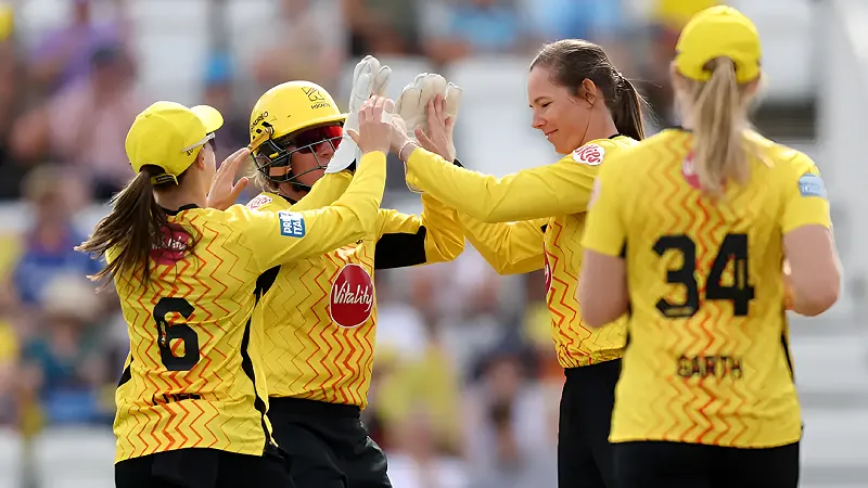 The Hundred Women’s 2026: Final, TR W vs SRL W Match Prediction – Who will win today’s match between Trent Rockets Women vs Sunrisers Leeds Women?August 15, 2026 / 12 hours ago Trent Rockets Women vs Sunrisers Leeds Women Trent Rockets Women vs Sunrisers Leeds Women (Source: trentrockets on IG/sunrisersleeds on IG) The Hundred Women’s 2026 competition has reached its last frontier as the Trent Rockets Women (TR W) will be up against the might of the Sunrisers Leeds Women (SRL W) for the Final at the Lord’s Cricket Ground, London, on Sunday, August 16. The Trent Rockets Women were dominant throughout the league stage and made it to the final courtesy of their first-spot finish on the points table at the end. They will be desperate to get their hands on the silverware and script history. There’s also a very unique chance that both the men’s and women’s franchises taste glory on the same evening. The Sunrisers Leeds Women, on the other hand, remained in great form and qualified for the Eliminator. In the penultimate clash, they beat the Southern Brave Women to make their way through. They may have had a longer route to the final, but it should also be noted that they have won all five of their preceding fixtures, demonstrating the thunderous form they are in. They will certainly fancy extending their winning streak with a victory in this clash. TR W vs SRL W: Match Details Match Trent Rockets Women vs Sunrisers Leeds Women, Final, Hundred Women’s 2026 Date and Time (IST) Sunday, August 16, 6:45 PM Venue Lord’s Cricket Ground, London Broadcast and Live Streaming JioStar Network Channels and JioHotstar (App & Website) Lord’s Cricket Ground, London: Pitch Report The pitch at the Lord’s Cricket Ground in London will be offering a sporty wicket, where scoring runs will become relatively easier in the second half, while the bowlers are expected to be the party animals in the first innings. While the pacers are known to generate a considerable amount of assistance from the wickets here, the spinners can come into play only if they bowl a little slower through the air. TR W vs SRL W: Head-to-Head Record Matches Played 05 Won by TR W 02 Won by SRL W 03 No Result 00 First-ever Fixture July 26, 2021 (SRL W Won) Most recent Fixture August 02, 2026 (TRT W Won) TR W vs SRL W: Predicted Playing 11s Trent Rockets Women Sophia Dunkley, Beth Mooney (WK), Sophie Luff, Ashleigh Gardner (C), Bess Heath, Georgia Adams, Nat Sciver-Brunt, Georgia Elwiss, Kim Garth, Charley Phillips, Samantha Bates Sunrisers Leeds Women Bryony Smith, Phoebe Litchfield, Lauren Winfield-Hill (WK), Annabel Sutherland, Deepti Sharma, Dani Gibson (C), Jess Jonassen, Darcey Carter, Kate Cross, Cassidy McCarthy, Hannah Baker TR W vs SRL W: Probable Best Performers of the Match Probable Best Batter: Phoebe Litchfield Phoebe Litchfield‘s bat has been doing all the talking in the Hundred Women’s 2026. She currently tops the run-scoring charts with 293 runs in nine matches. She has been providing phenomenal starts to the Sunrisers this season and is also excellent in scoring at a quick pace to extract maximum benefit during the powerplay overs. The Sunrisers, seeking a win on Sunday, have a lot depending on how Litchfield goes about her business against the Rockets. Probable Best Bowler: Deepti Sharma Though the conditions in London may not be as favourable for Deepti Sharma to have a say with the ball in the upcoming fixture, the off-spinner is skilled enough to pick up wickets on any kind of surface. The plethora of experience she boasts playing in the United Kingdom is quite evident as she is also the highest wicket-taker of the current edition with 13 wickets in nine matches, desperate to add a few more before signing off.