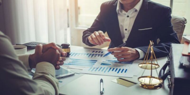 Business lawyer working about legal legislation in courtroom to help their customer