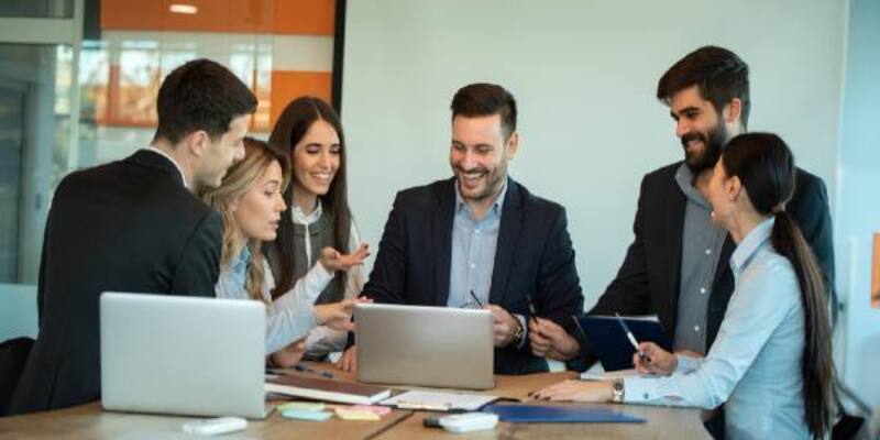 Business people brainstorming marketing plan researching paperwork