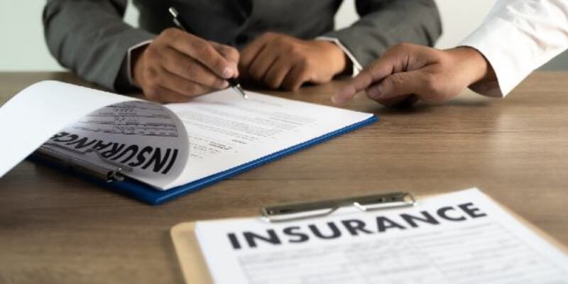 Concept of insurance man protective and health insurance policy examining