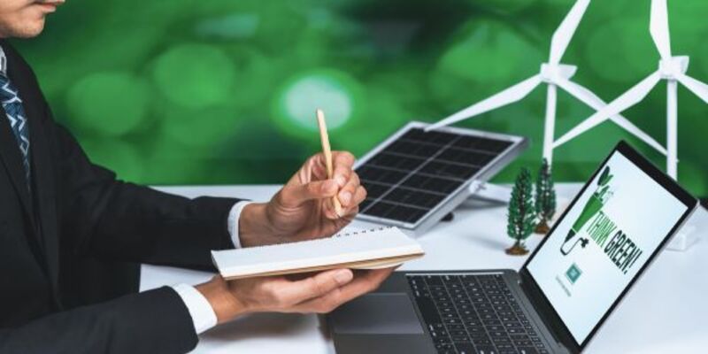 Businessman working in office developing plan on alternative energy gyre