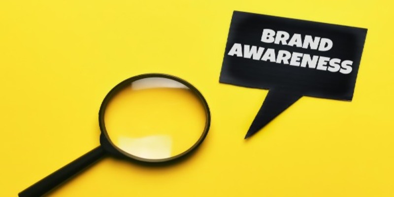 Top view black bubble speech written brand awareness with magnifying glass