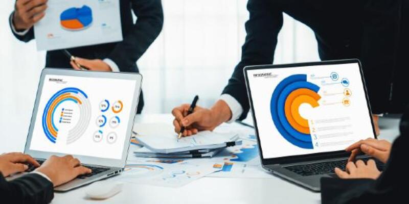 Business people in group meeting in formal attire share idea discussing report for company profit