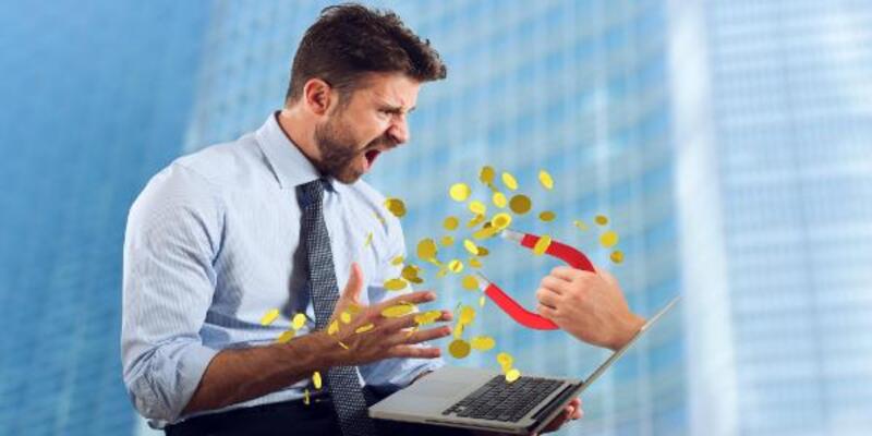 Young man using laptop in city