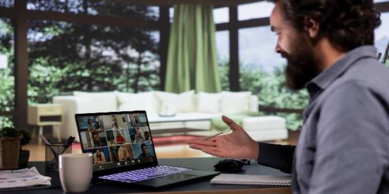 Executive board member communicates with investors via teleconference