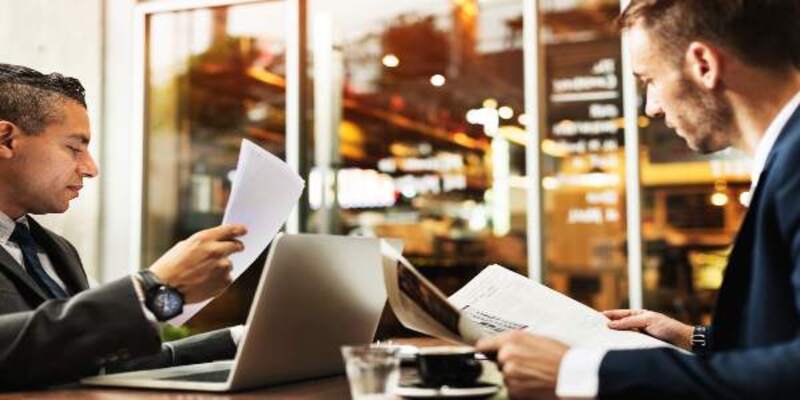 Businessmen working technology paper concept