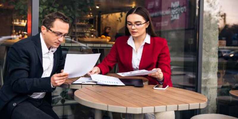 Business people having a business negotiation at a cafe
