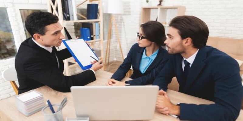 People looking at a paper