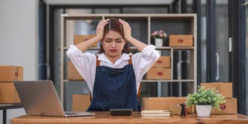 Small business owner woman with unsuccess business online shopping crying and serious face unhappy