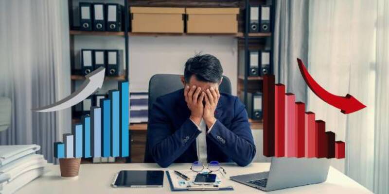 Another failure laptop displaying a business graph person working on data analysis technology and finance recession concept