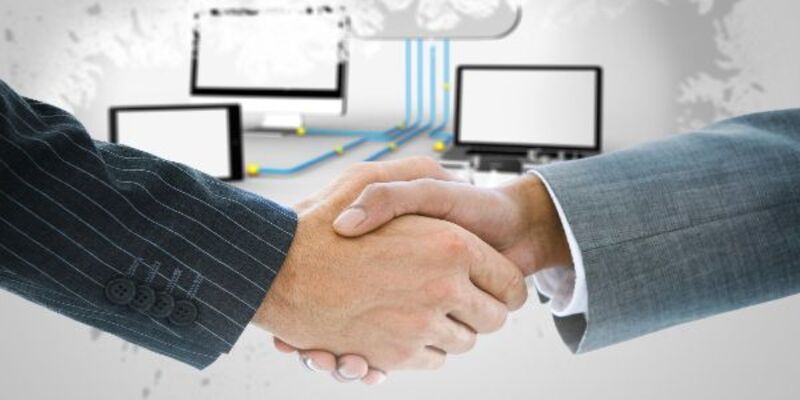 Composite image of business handshake