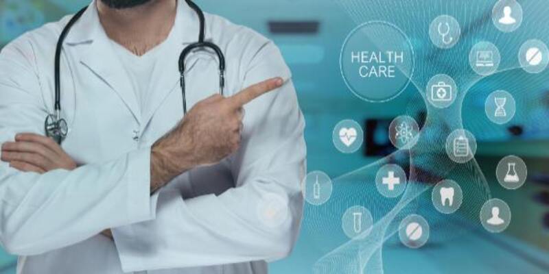 Doctor with stethoscope pointing his finger to health care icons
