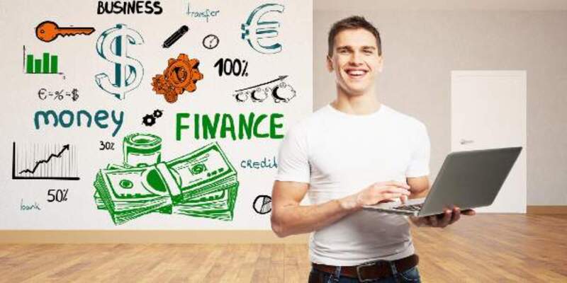 Man standing with laptop in hand and finance concept background