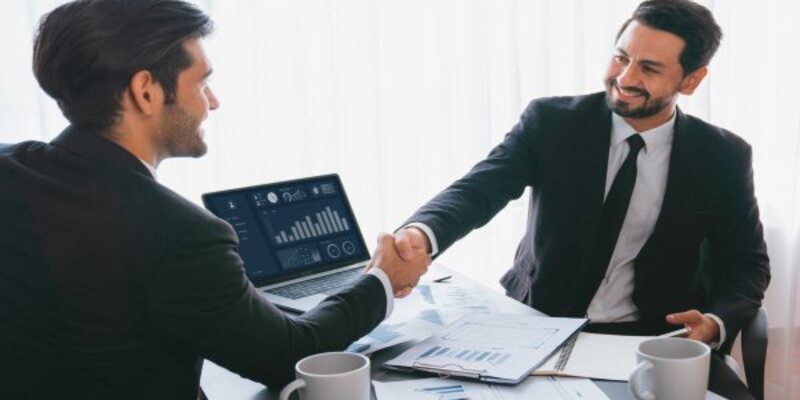 two-men-shaking-hands-one-which-is-business-model