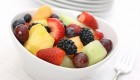 A white bowl of fresh fruit salad