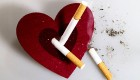 A stylized heart shaped ash bowl with cigarettes