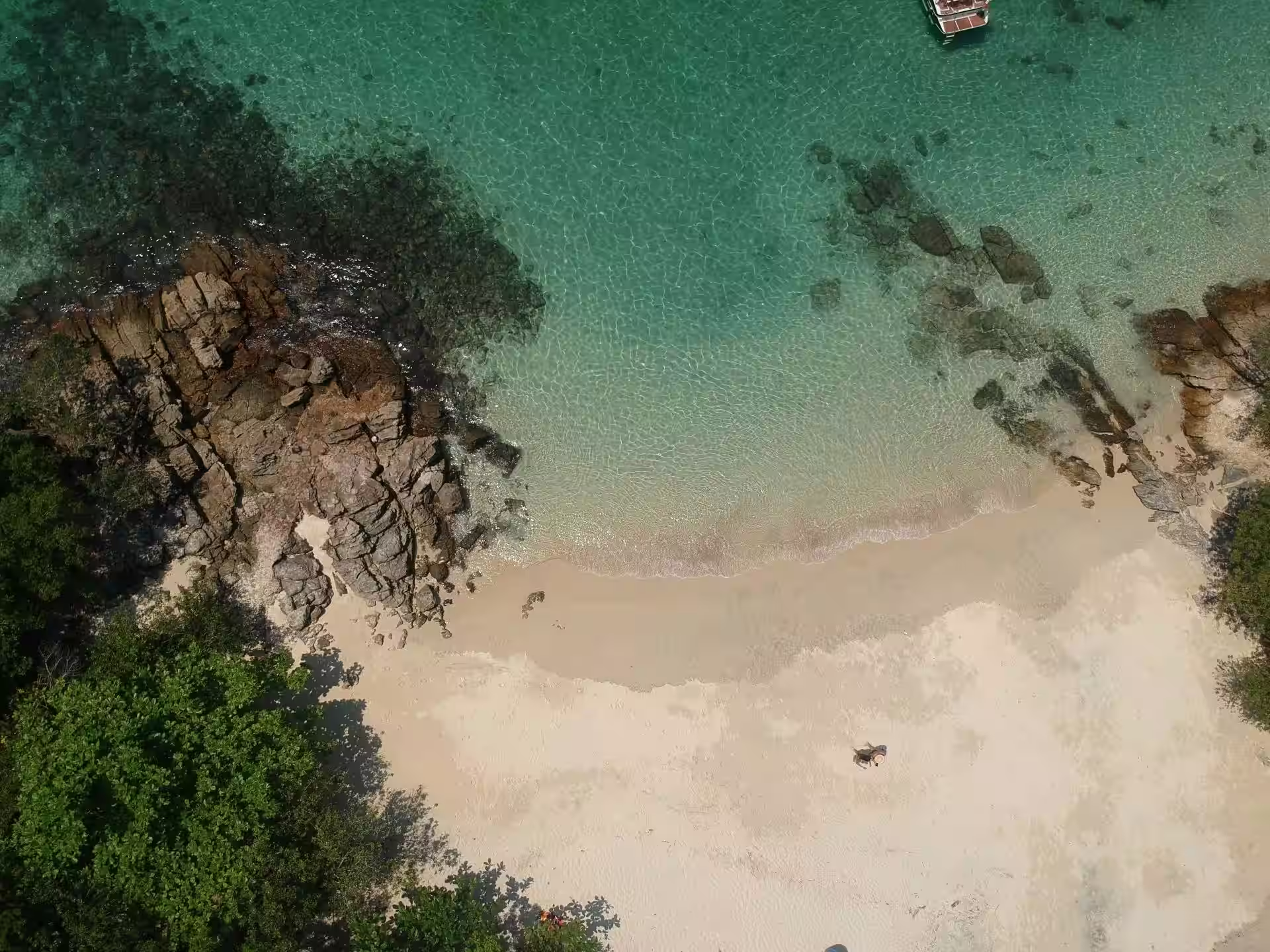 Quiet beach with shallow waters at Anse aux Pins
