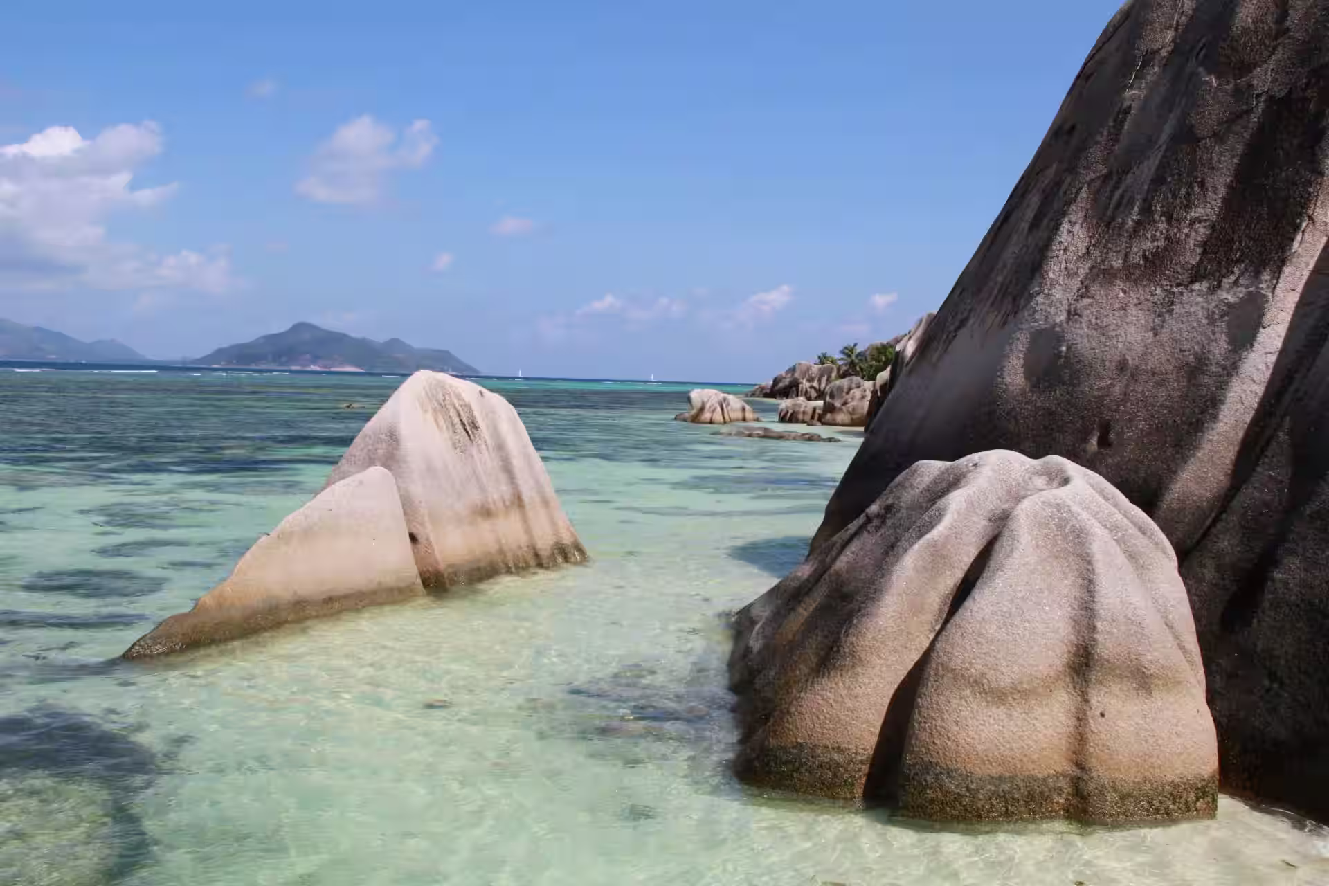 Rocky coastline and blue sea at Anse Baleine