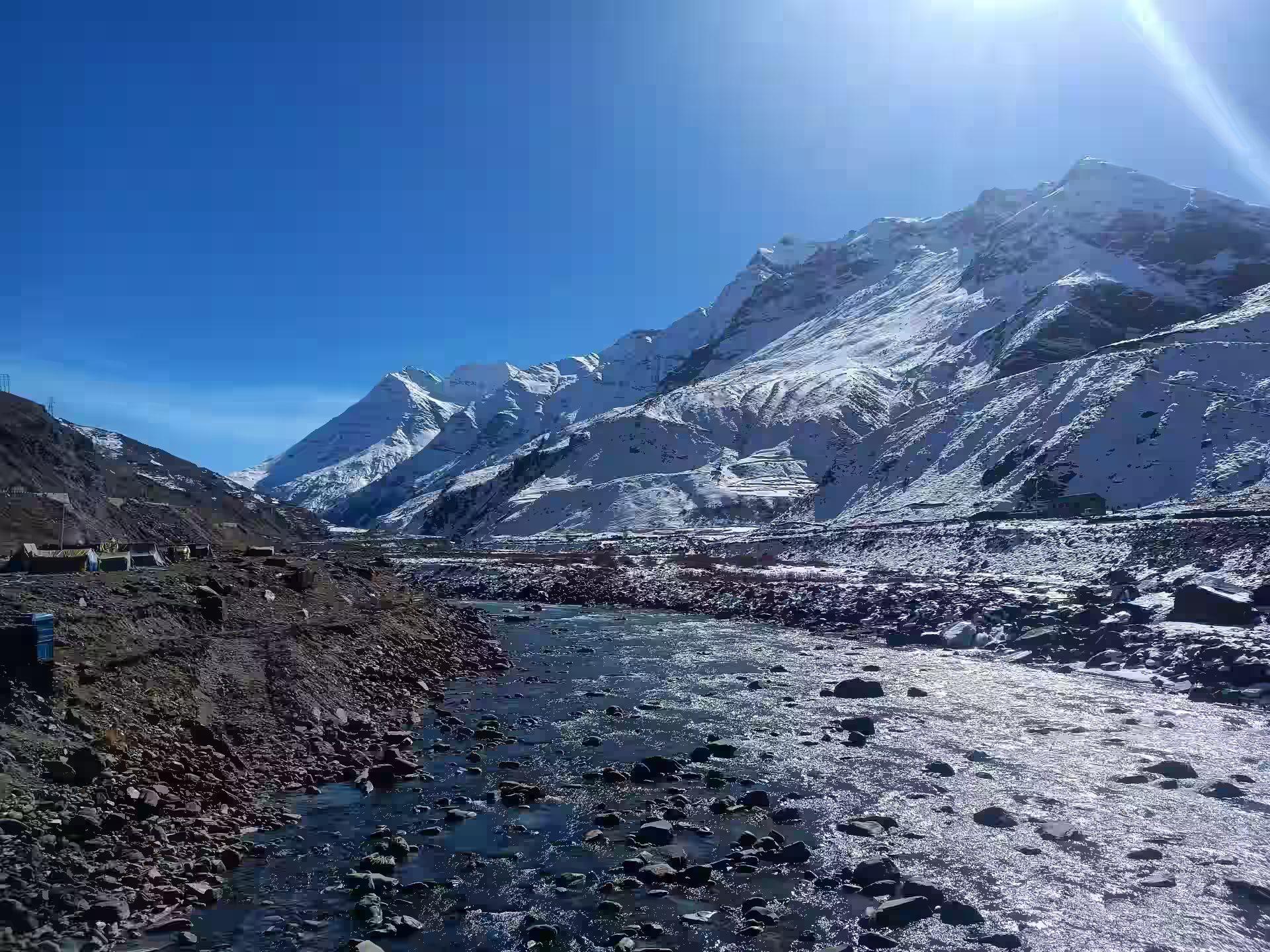 Snow capped mountains and river valley in Manali