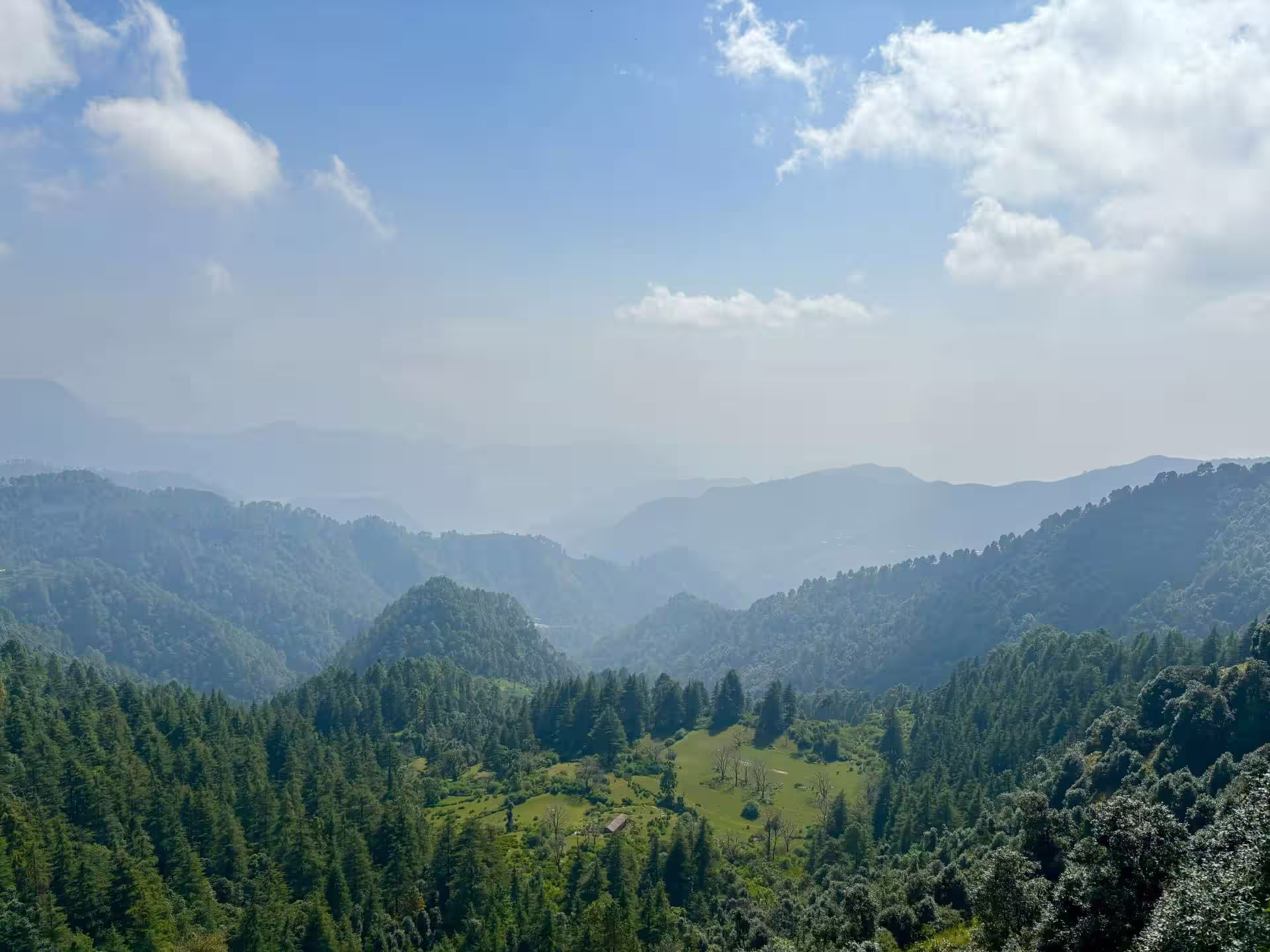 Mussoorie hill station in Uttarakhand with mountain views and clouds