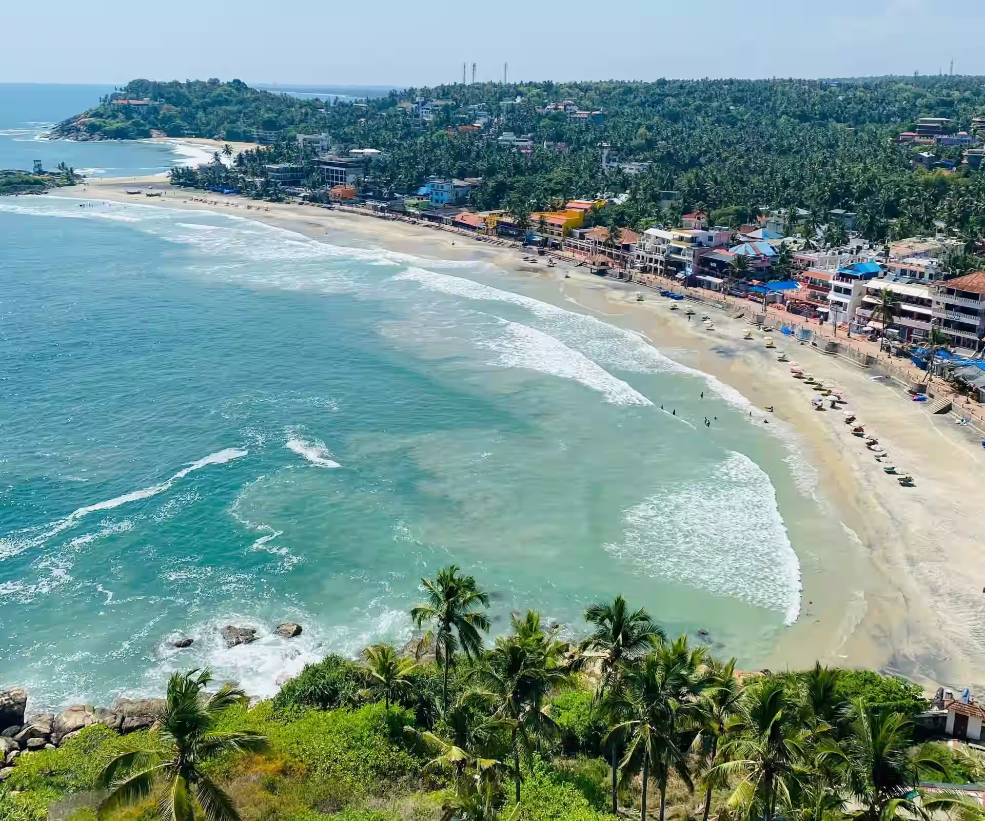 Kovalam Beach with palm trees in Kerala
