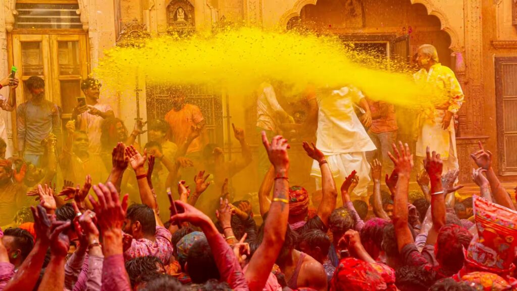 People celebrating Holi festival with colors in India