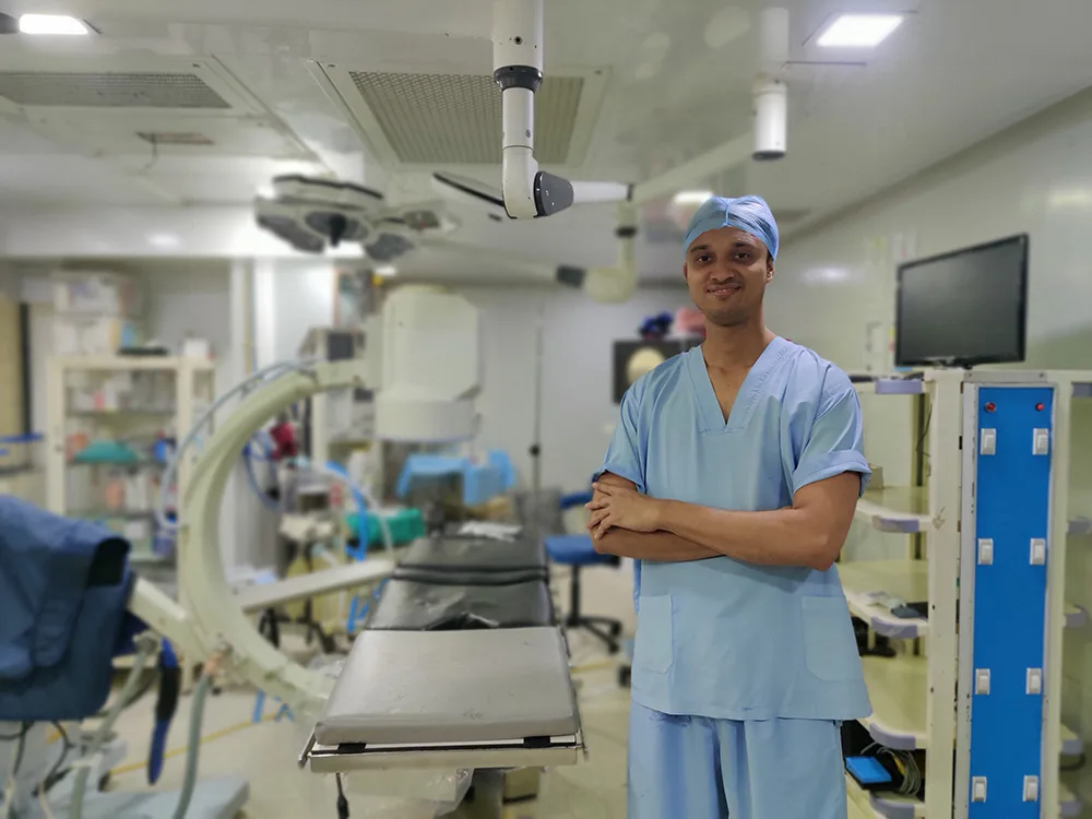 Dr. Shyam Mohan with Robotic Surgical System