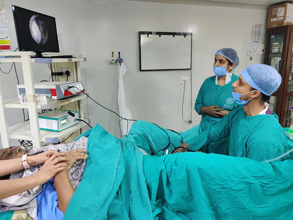 Dr. Shyam Mohan with Robotic Surgical System