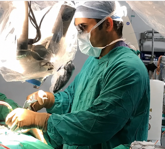 Dr. Sunil Kutty performing brain and spine surgery