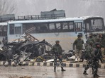 Security personnel stand guard hours after a suicide bomber rammed an explosives-laden car into a CRPF bus on the Jammu-Srinagar highway. (HT Photo)