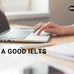 A pair of hands typing with "A Good IELTS Score"
