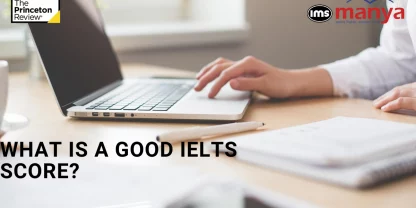 A pair of hands typing with "A Good IELTS Score"