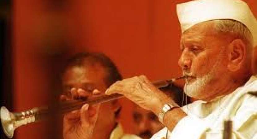 Khan performing Shehnai Music
