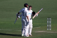 Nicholls' ton puts New Zealand on top
