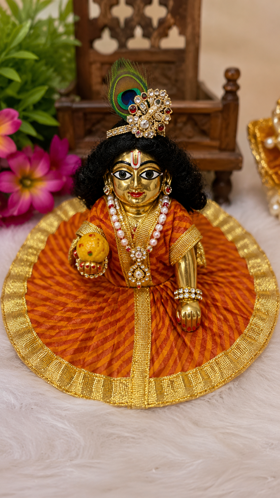 Red and yellow striped leheria print poshak (dress) designed for a Laddu Gopal or Thakur Ji idol.
