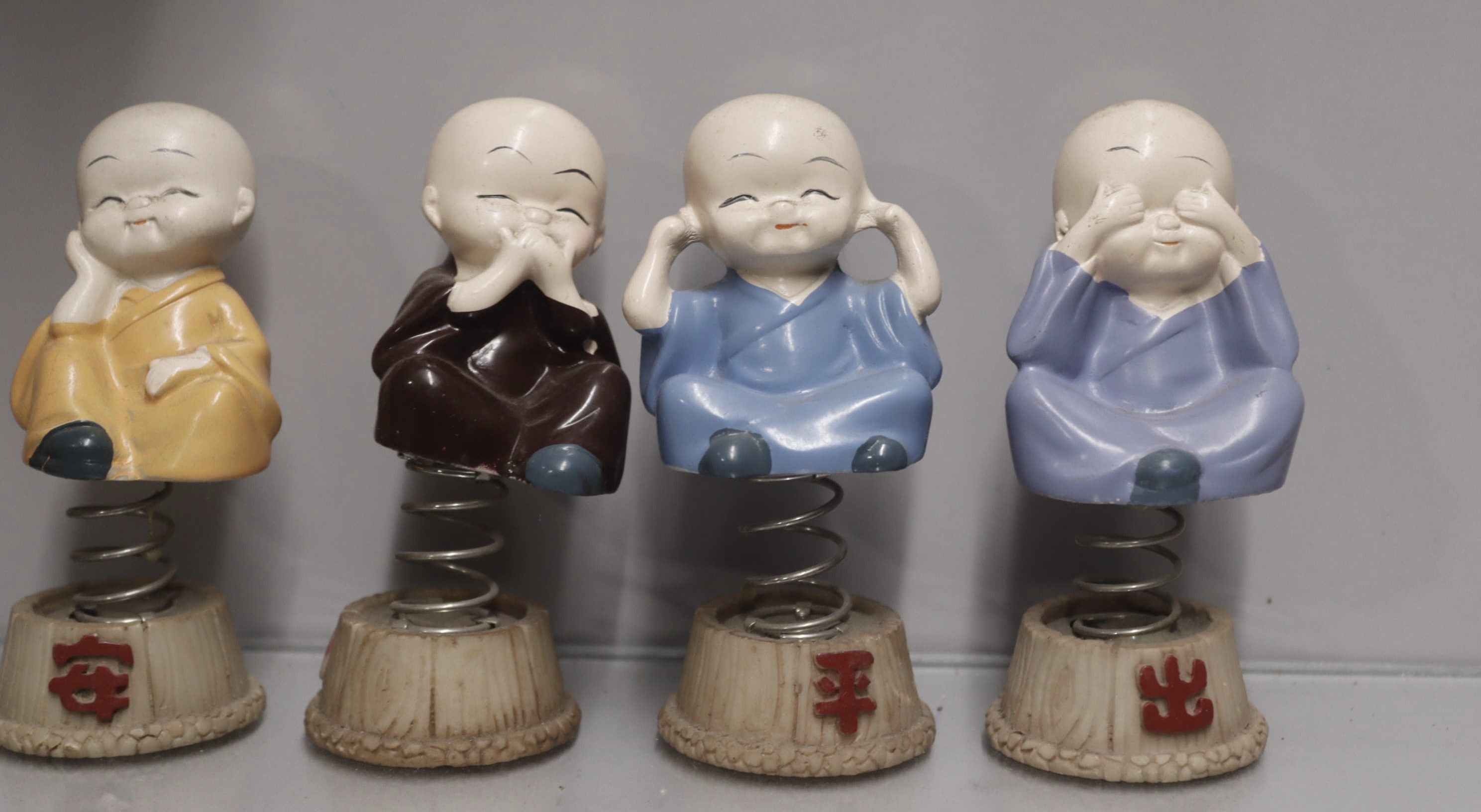 Avish Buddha Idols for Car Dashboard Figurines/Spring Monk Buddha Figurines/Cute Small Kung Fu Creative Resin Little Spring Swing Little Buddha for Home Office,Interior Desk Decor. Decorative Showpiece - 9.5 cm (Polyresin, Multicolor) Decorative Showpiece  -  9 cm (Polyresin, Multicolor)
