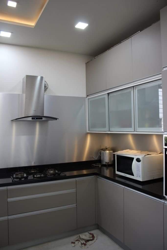 Elegant Kitchen Wardrobe Design with Frosted Glass Panels