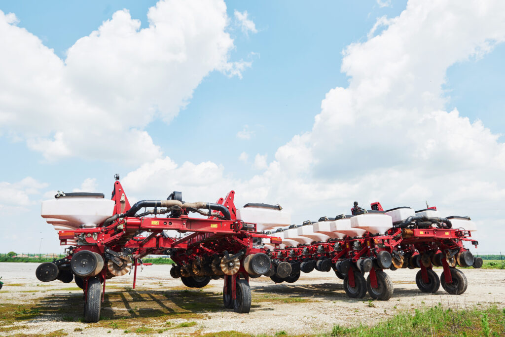Close up shot of airseeder attached with tractor.
