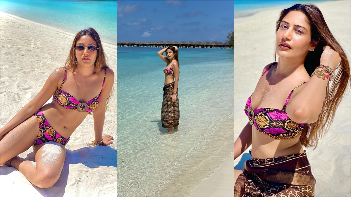 'Ishqbaaz' actress Surbhi Chandna bikini: 'इश्कबाज' अदाकारा सुरभि चंदना (Surbhi Chandna) ने सोशल मीडिया पर कुछ बोल्ड बिकिनी तस्वीरें पोस्ट कर फैंस के बीच तहलका मचा दिया हैं। अभिनेत्री ने मालद्वीप से यह तस्वीरें साझा की हैं। इस तस्वीरों में सुरभि चंदना अलग-अलग पोज देते हुए तस्वीरें खिंचवाती दिखाई दी। उनका ये अंदाज उनके फैंस को दीवाना बना रहा है। तस्वीरों में आप देख सकते हैं कि अदाकारा ने स्नेक प्रिंटेड बिकिनी पहन रखी है। कुछ घंटो पहले पोस्ट इन तस्वीरों को अब तक 2 लाख से ज्यादा लाइक मिल चुके हैं। आप भी देखिए ये ताजा तस्वीरें- (फोटो साभार- @ Surbhi Chandna) 