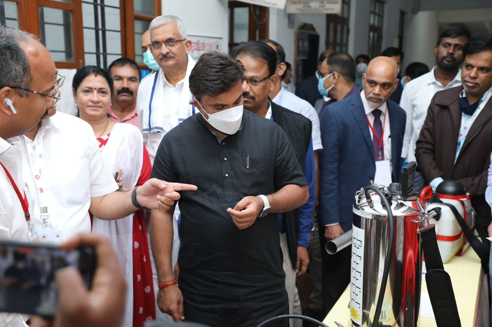 Officials showing the fumigation machines to Health Minister Dr K Sudhakar