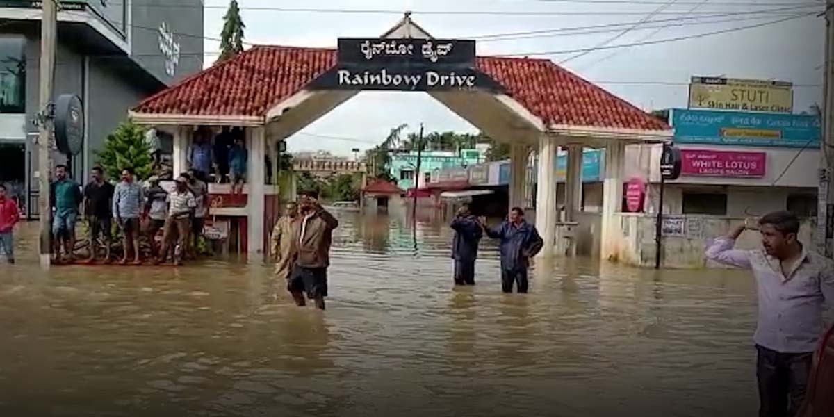 Citizens struggle as Bengaluru localities get flooded. (South First)