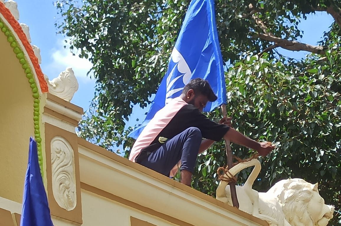 Dalit agitator A Dalit agitator tying the flag to the lion's tail on Bhoothamma temple top in Ullerahalli