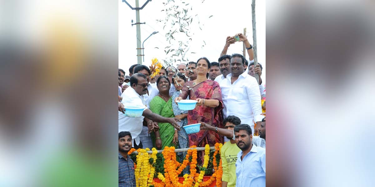 Telangana Minister Sabitha Indra reddy releasing fish seedlings into a lake in the Rangareddy district on Monday, 19 September. (South First)
