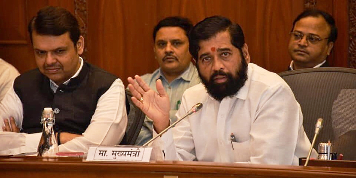 Eknath Shinde at the meeting Maharashtra Chief Minister Eknath Shinde (right) with Deputy Chief Minister Devendra Fadnavis at an all-party meeting on border issues on Monday, 22 November, 2022. (Supplied)